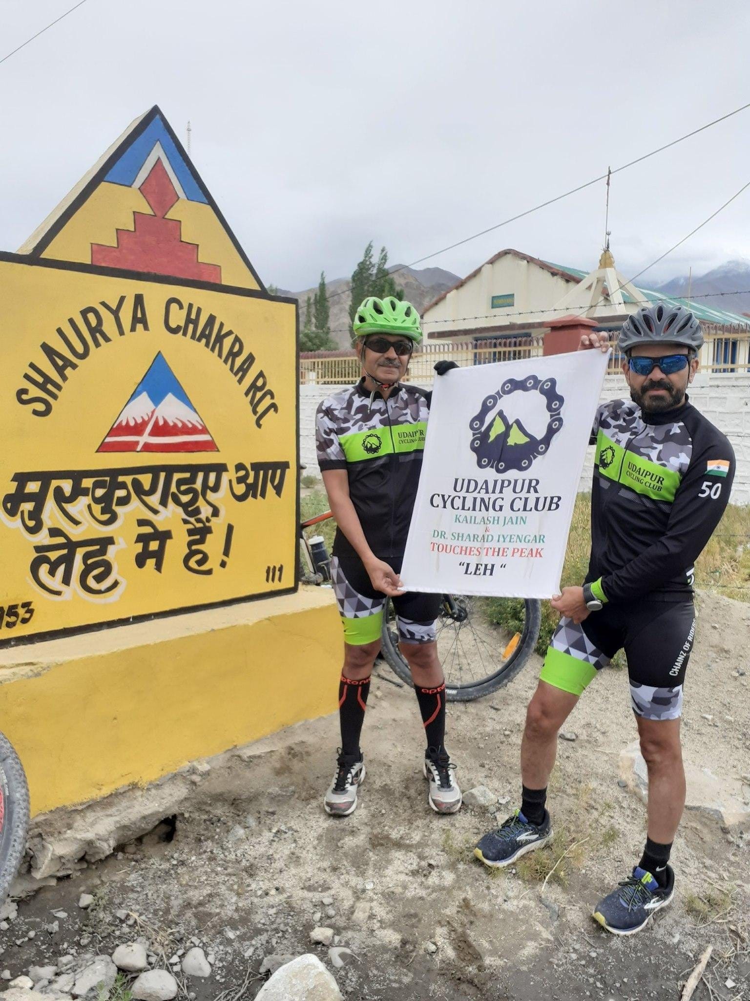 UCC riders with a club banner in Leh